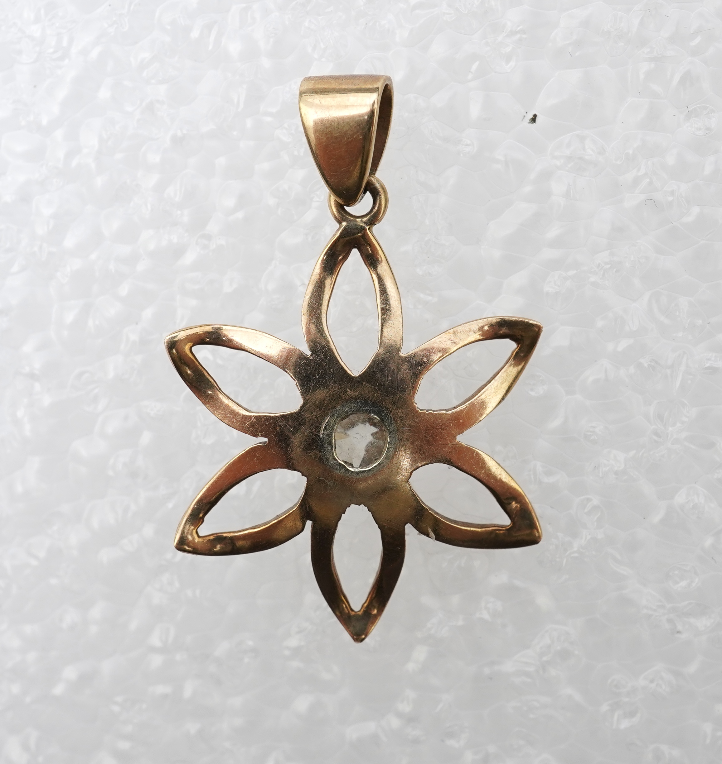 A gold and diamond pendant, mid 20th century